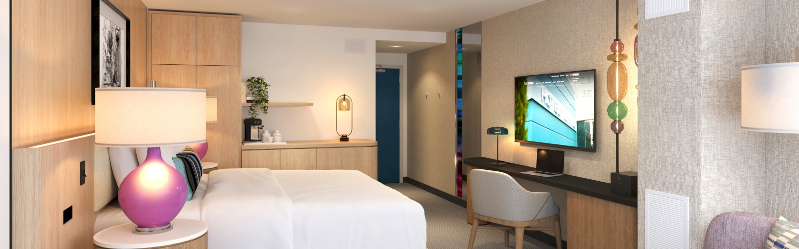 A modern hotel room features a bed, bedside lamps, a TV, a desk, and stylish decor with warm lighting and neutral tones.